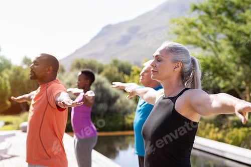 Preview: Mature group of people doing breathing exercise