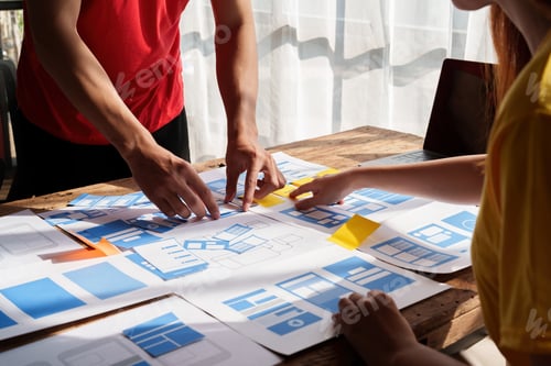 Preview: Group of ux developer and ui designer brainstorming about app interface design at modern office