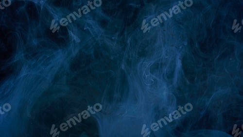 Preview: Blue paint drops mixing in water slow motion. Stock footage. Smooth ink swirling and splashing from