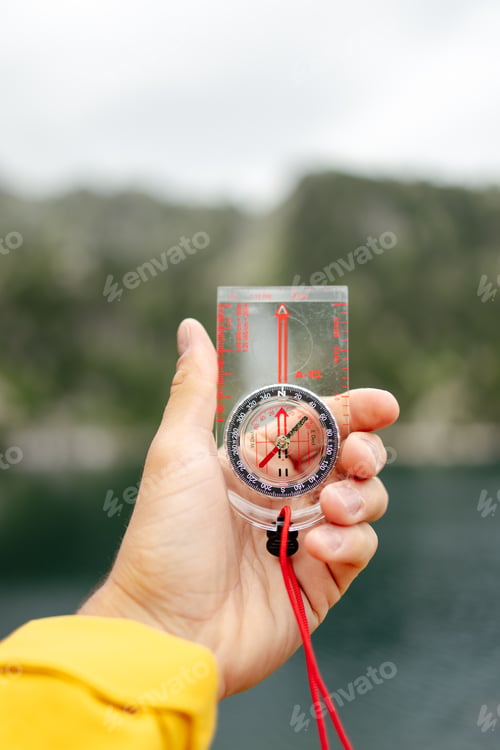 Preview: Close up of a hand holding a compass