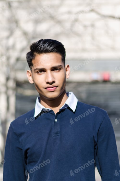 Preview: close up portrait of young student man looking at the camera