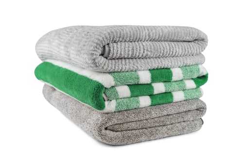 Preview: Soft Fluffy Striped Grey And Green Bath Towels Folded In Stack Isolated On White Background