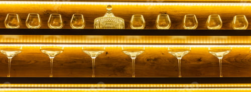 Preview: Glasses of wine. Glasses hanging above the bar in restaurant. Empty glasses for wine. Wine and