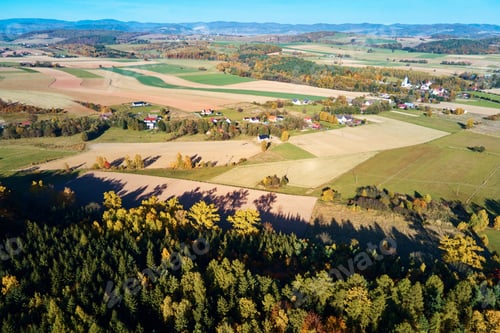 Preview: Mountain village and agricultural fields, aerial view. Nature landscape