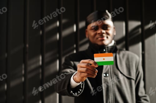Preview: Young african man hold flag