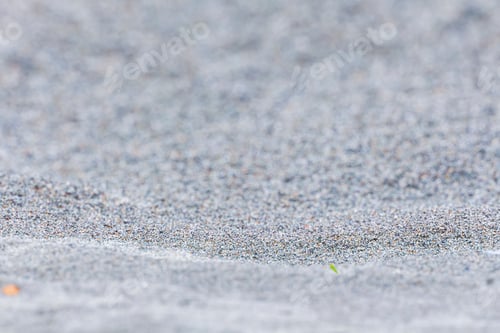 Preview: Selective focus of sand on beach. Close-up of sand with copy space. Focus on foreground.