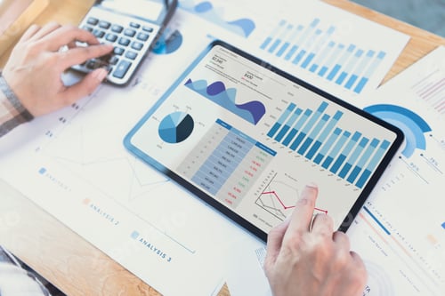 Preview: Businesswoman using a tablet to analysis graph company finance strategy statistics success concept