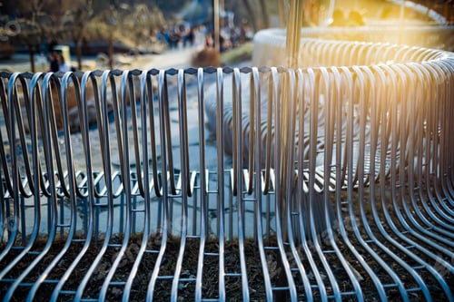 Preview: Close-up street bench metal pipes arranged parallel