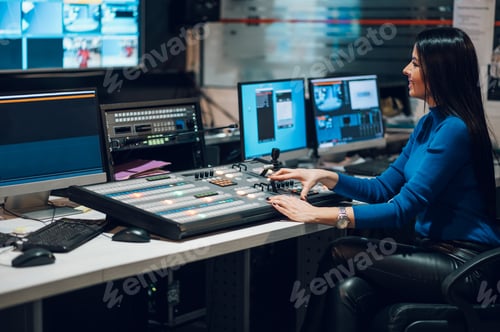 Preview: Middle aged woman using equipment in control room on a tv station