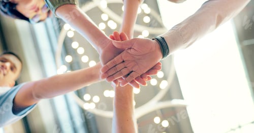 Preview: Teamwork, collaboration and low angle of business people with hands together in office. Team buildi