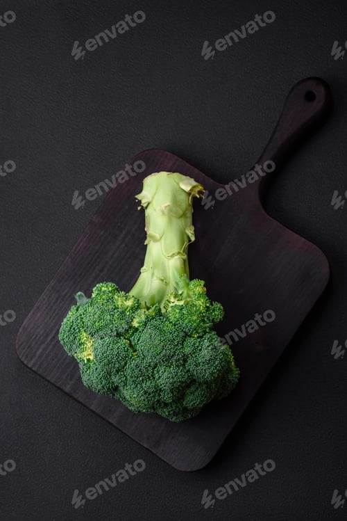 Preview: Raw fresh broccoli on a black home kitchen table
