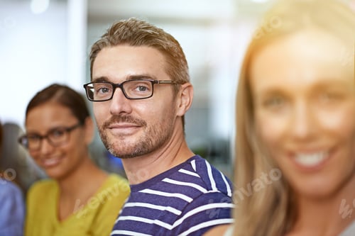 Preview: Surrounded by a great team. Cropped shot of a businessman standing between two female coworkers.