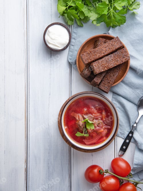 Preview: Traditional Ukrainian Russian borsch (beetroot soup) with meat in a black bowl