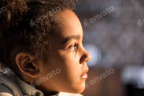 Preview: Close-up profile portrait of adorable african american girl looking away