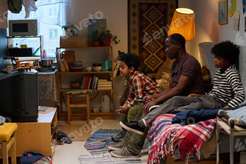 Preview: Family Watching TV Together in Cozy Living Room
