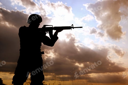 Preview: Soldier with machine gun patrolling outdoors. Military service
