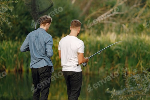 Preview: Two men fishing near the river