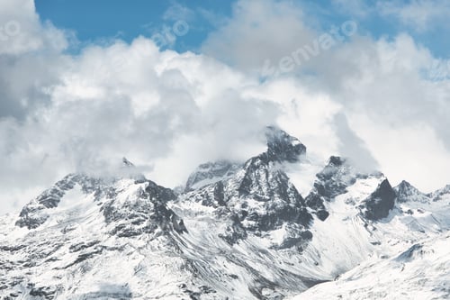 Preview: Mountain between sky and clouds