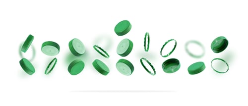Preview: Green bottle caps for recycling on a white background. Plastic caps levitating, floating in the air