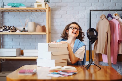 Preview: Female warehouse worker, seller, dropshipping small business owner recording new content for vlog.