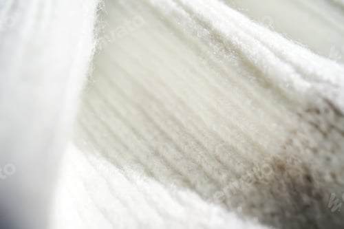 Preview: The texture of a warm sweater with a beige pattern.