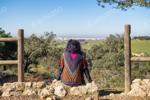 Preview: Mature woman enjoying freedom and nature view outdoors