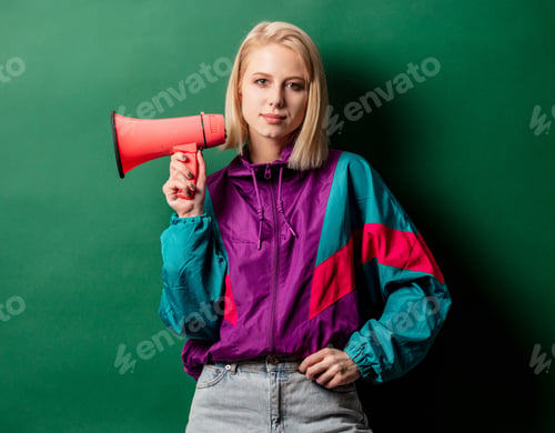Preview: woman in 90s style punk jacket with loudspeaker on green background