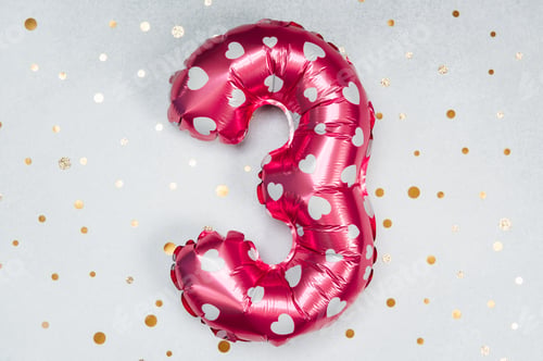 Preview: Pink heart-patterned balloon shaped like a three on a festive background