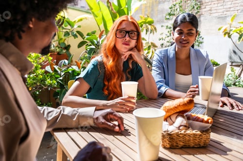 Preview: Multiethnic small group of businesspeople meeting in a coworking company office