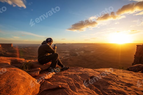 Preview: Hiker Meets Sunset At Grand View Point In Canyonlands National Park In Utah, Usa