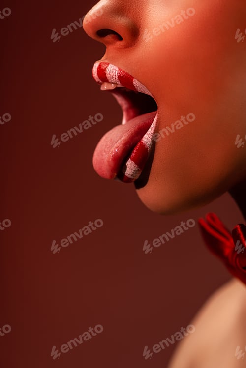 Preview: cropped shot of seductive african american woman with red and white lips showing tongue out isolated