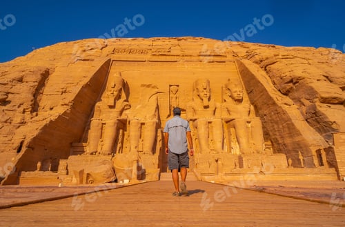 Preview: A Young Man Walking Towards The Abu Simbel Temple In Southern Egypt In Nubia Next To Lake Nasser