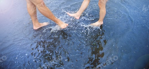 Preview: Feet in puddle