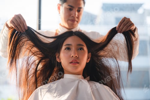 Preview: woman client person having a process to making treatment a hair with hairdresser in beauty salon