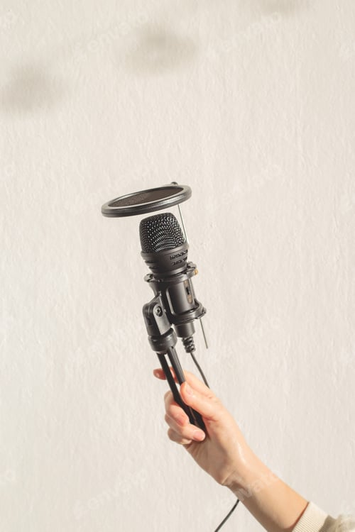 Preview: Podcast Equipment - Female Hand Holding Microphone.