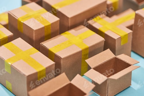 Preview: close up view of cardboard postal boxes on blue background