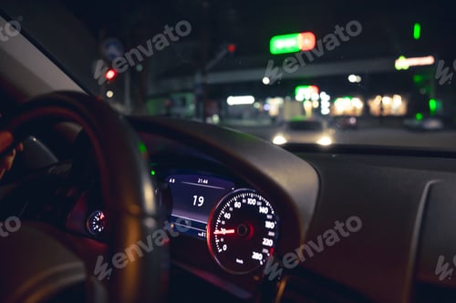Preview: Close-up, car speed indicators in a car at night.