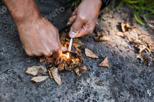 Preview: Man igniting camp fire