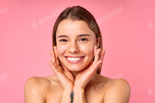 Preview: Smiling Woman with Bare Shoulders on Pink Background