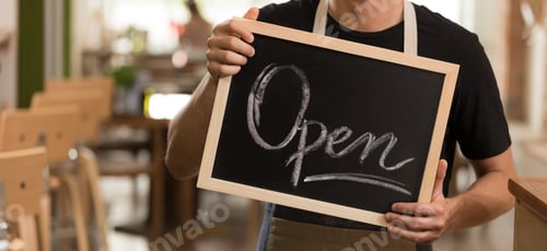 Preview: Man holding a blackboard