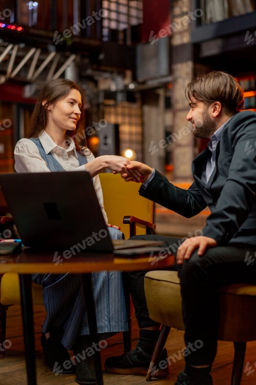 Preview: yellow office chairs a businessman made a deal with a female director peace treaty shaking hands
