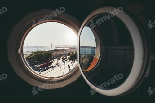 Preview: A cityscape through the round window