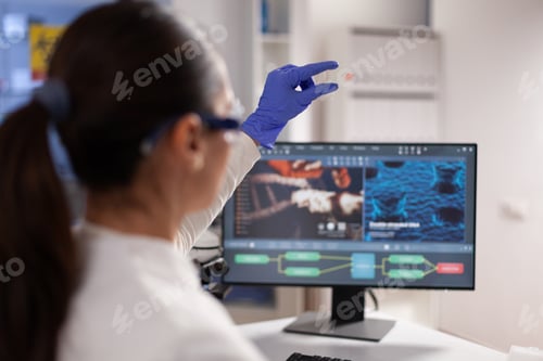 Preview: Microbiologist scientist woman holding slice with blood sample
