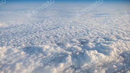 Preview: The beautiful cloudscape with clear blue sky. A view from airplane window.