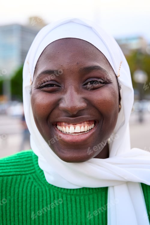 Preview: Portrait of black muslim woman very happy, smiling and looking at camera