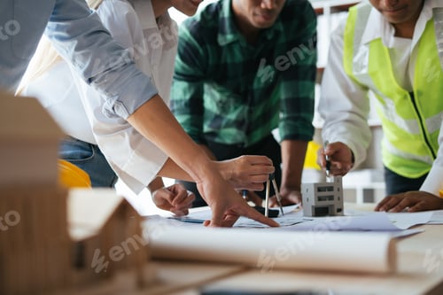 Preview: Close up view of Engineers and Architect working together on construction project.