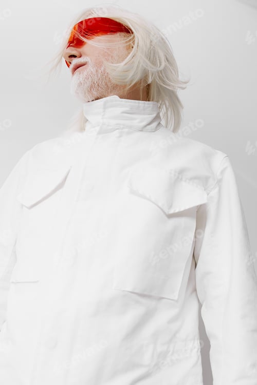 Preview: Futuristic fashion model in white outfit with red sunglasses, exuding a modern and avant garde style