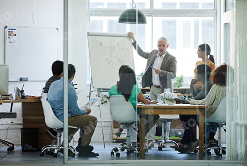 Preview: Lets turn our attention to these figures. Shot of a group of coworkers in a boardroom meeting.