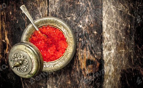 Preview: Red caviar in a saucer.