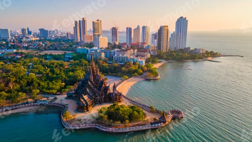 Preview: Sanctuary of Truth, Pattaya, Thailand, wooden temple by the ocean at sunset on the beach of Pattaya